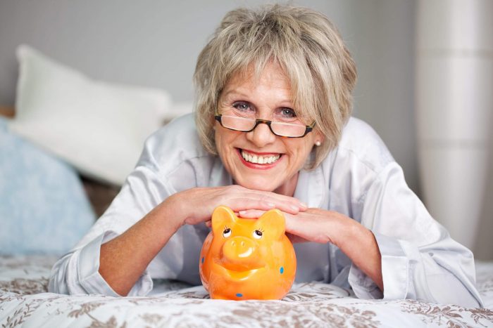 21289981_l-saving-senior citizen with piggy bank